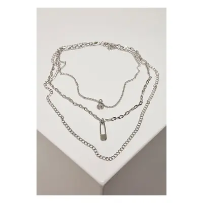 Layered necklace with a silver-colored amulet