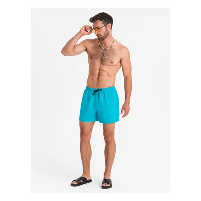 Ombre Neon men's swim shorts with magic print effect - turquoise