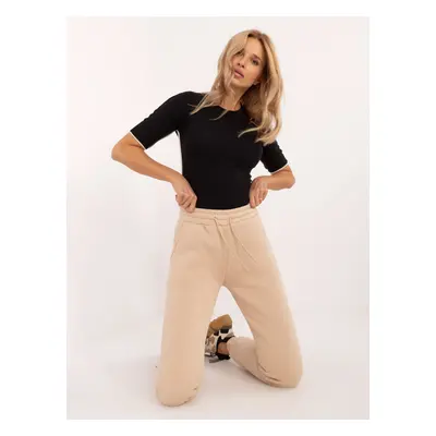 Beige insulated sweatpants with pockets