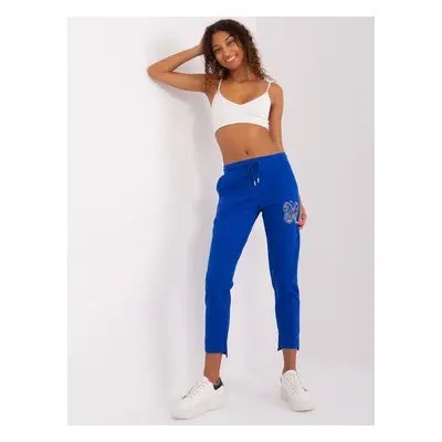 Cobalt blue sweatpants with appliqués