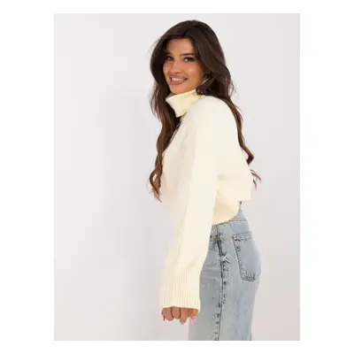 Light yellow women's turtleneck with patterns