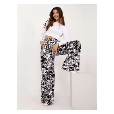 White and black two-piece set with long trousers