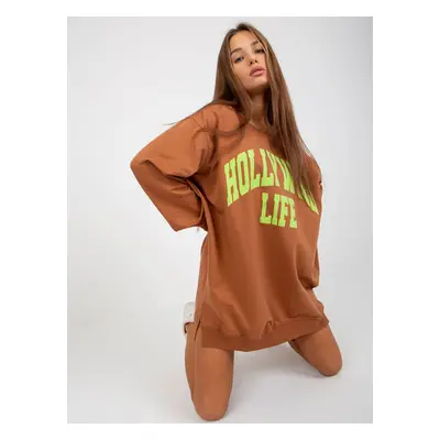 Light brown and green long sweatshirt with slogan