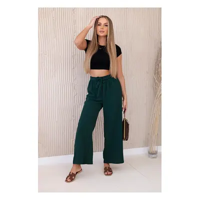 Wide-waisted trousers in dark green colour