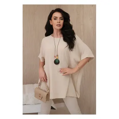 Oversized blouse with pendant in beige color