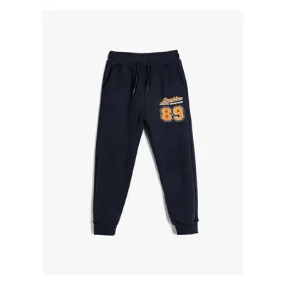 Koton Jogger Sweatpants with Tied Waist and Sports Print Detail