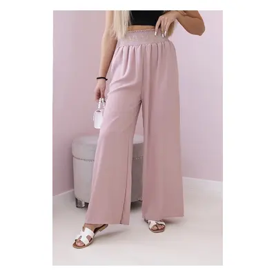 Trousers with a wide elastic waistband in dark pink colour