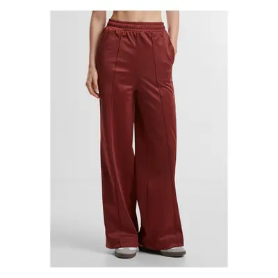 Women's trousers with creases on the sides in dark rust color