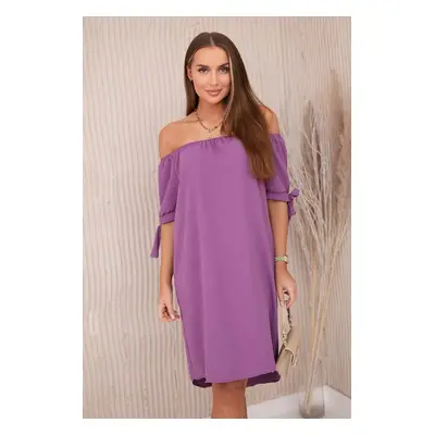 Dress with a longer back and ties on the sleeves plum