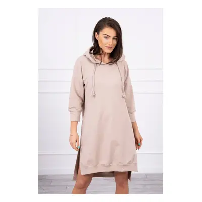 Dress with a hood and a longer back in beige color