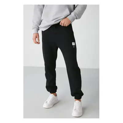 GRIMELANGE Rowan Men's Relaxed Black Sweatpants with Ribbed Front Decorative Label and Lined Int