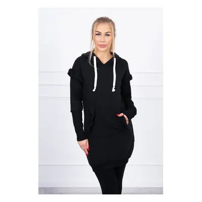 Black dress with decorative ruffles and hood