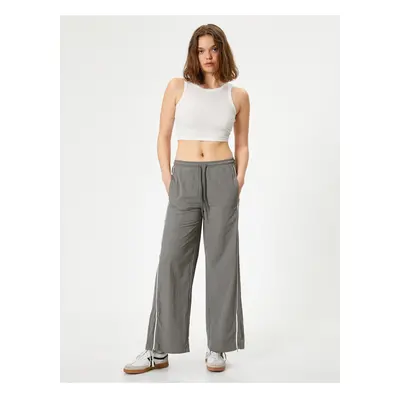 Koton Parachute Trousers with Wide Leg Pockets and Tied Waist