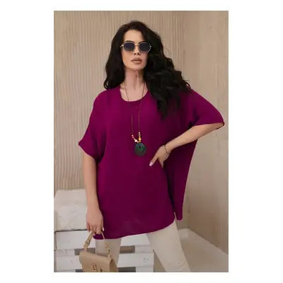 Oversized blouse with plum pendant