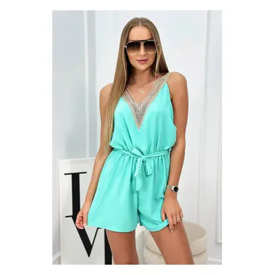 Short jumpsuit with decorative mint lace