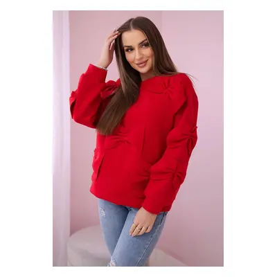 Insulated sweatshirt with decorative bows in red