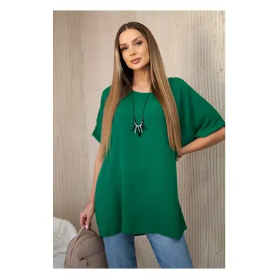 Oversized blouse with a pendant in dark green color